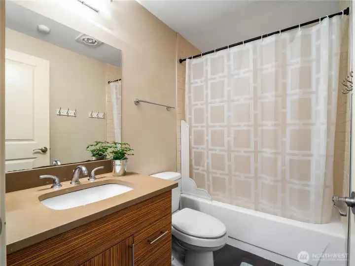 The Full bath is conveniently located right next to the bedroom.