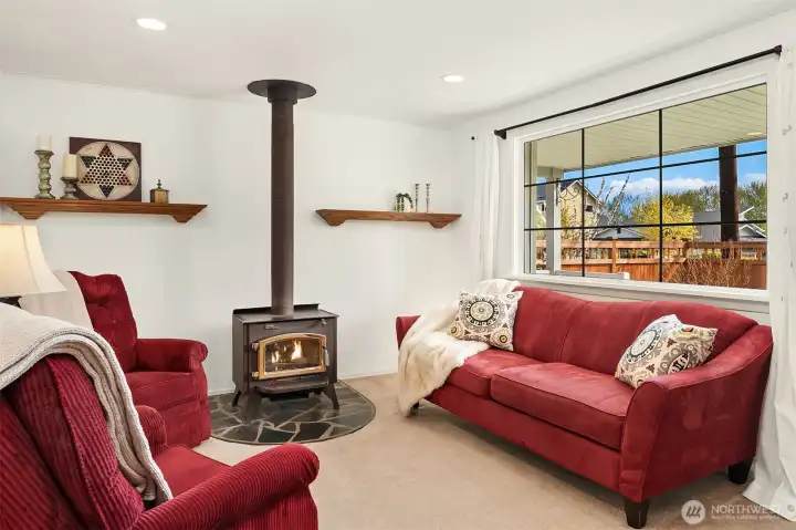Cozy and Bright living room. Hardwood floors throughout under carpet.