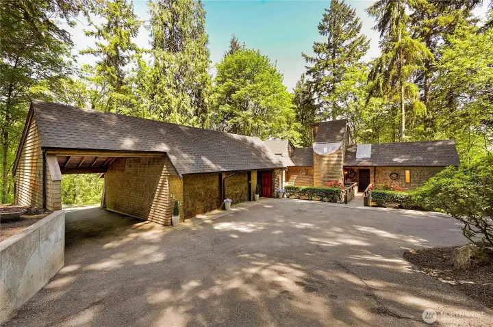 2 car garage + carport + large loft + office/art studio/shop/workout room + tool shed