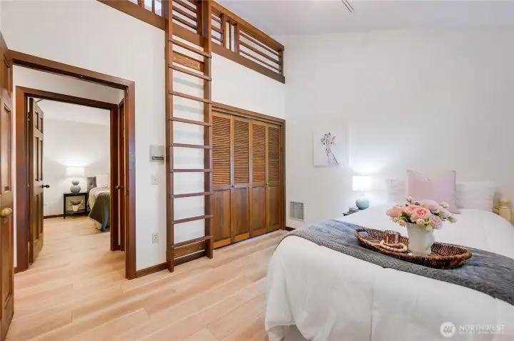 Bedroom 2 with ladder up to playroom