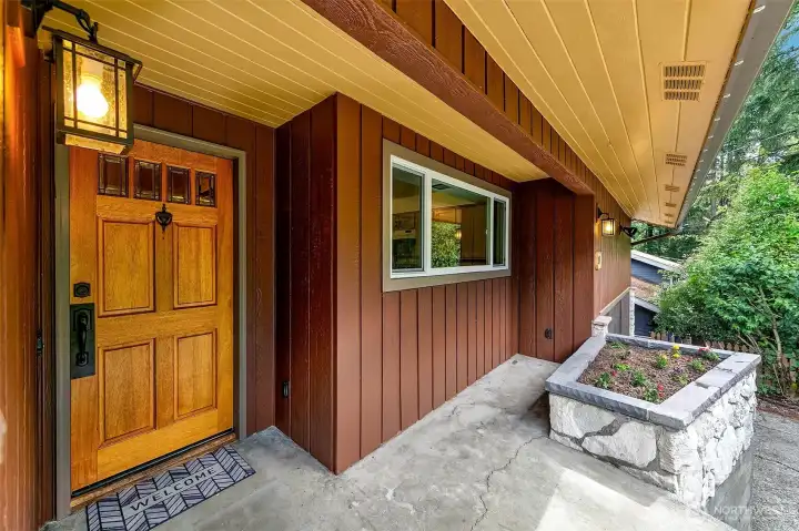 Welcoming custom wood front door.