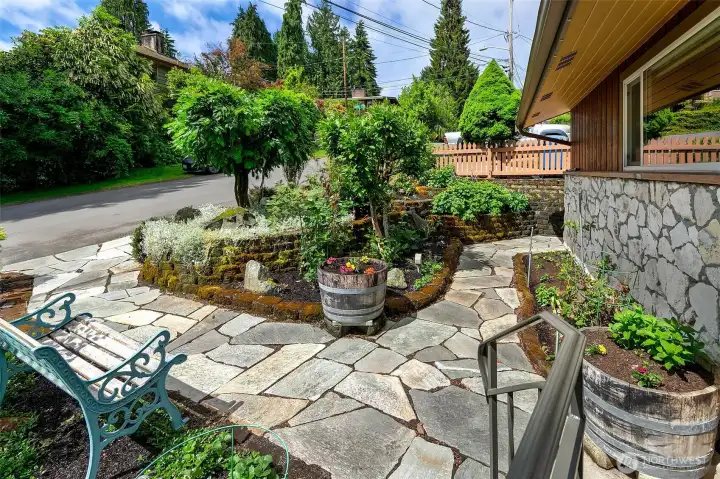 Dramatic stone walkways and built in planters.