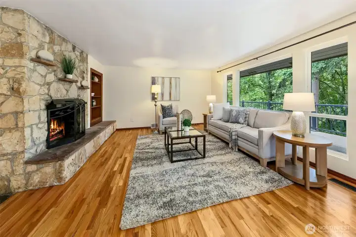 Large living room with wood burning fireplace.