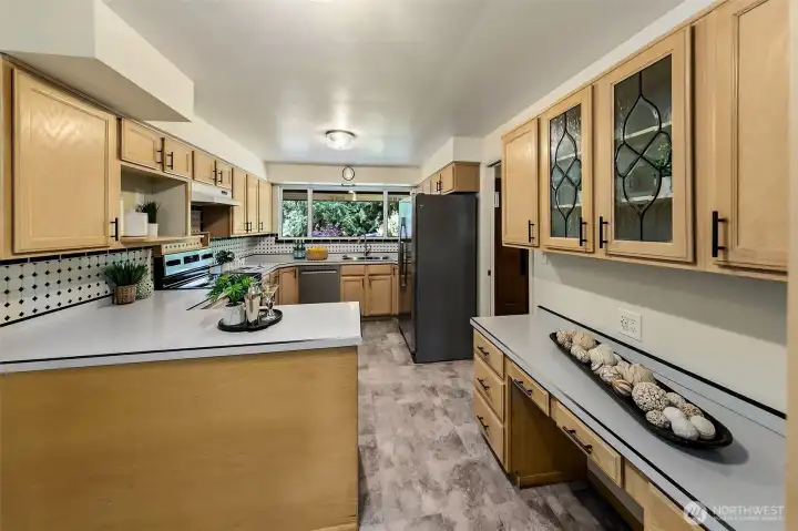spacious kitchen with new floor and range.