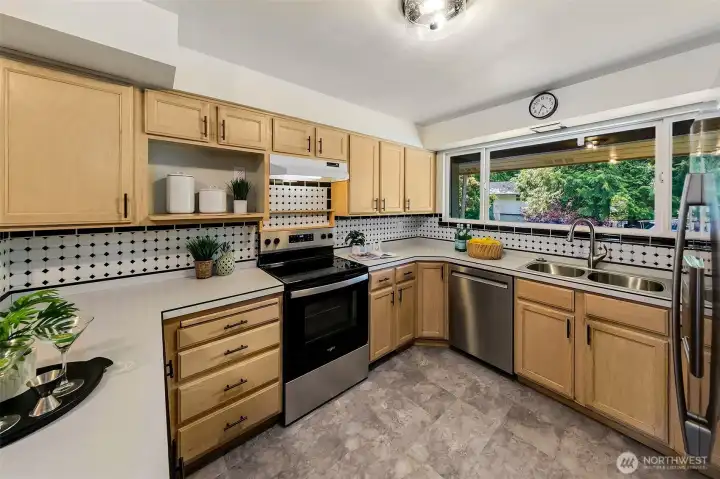 Large south facing window bathes the kitchen in natural light.