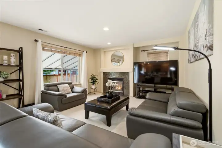 Large living room features Gas Fireplace & Newer carpet Large living room features Gas Fireplace & Newer carpet
