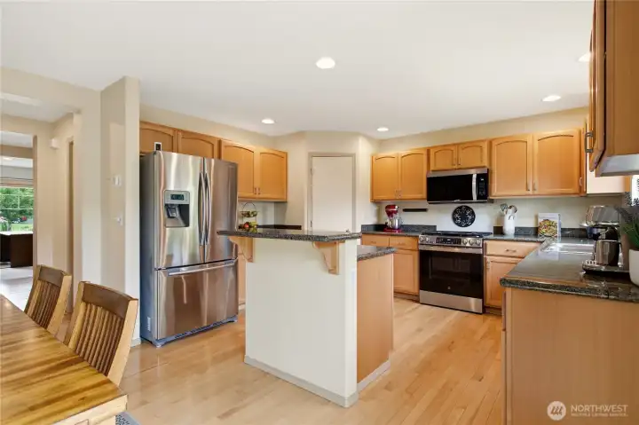Clean, functional open concept kitchen with island. Clean, functional open concept kitchen with island.