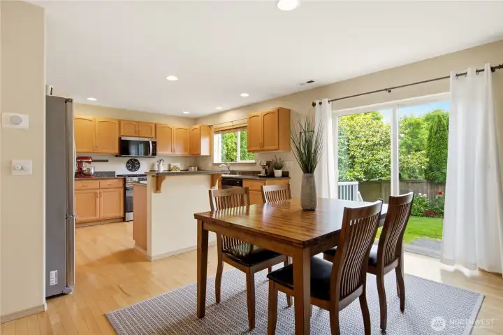 Kitchen with island seating, walk-in pantry, and an open connection to the living and dining areas as well as the gateway to the backyard Kitchen with island seating, walk-in pantry, and an open connection to the living and dining areas as well as the gateway to the backyard