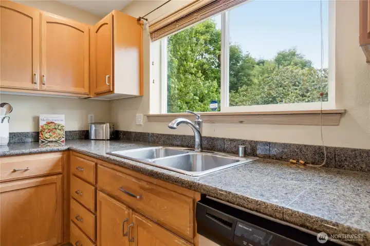 A window overlooking the beautiful park-like backyard. The view is great from here! A window overlooking the beautiful park-like backyard. The view is great from here!