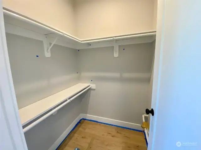 Photo of previous build and not of home currently under construction  Primary walk-in-closet