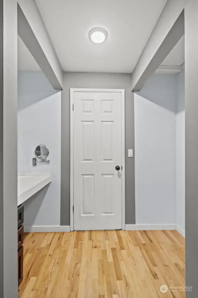 Primary closet on right, and makeup vanity on left.