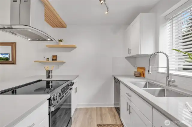 All new cabinets with slow close drawers, extra large double sink with new adjustable spray faucet.  Garbage disposal is also in the sink.