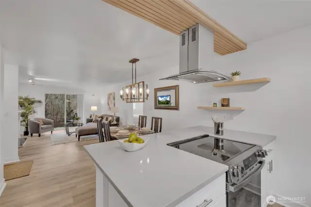 Seating at the cooktop counter is an option.  Nice extension of the quartz counter neatly accommodates stools for the informal dining.  Sleek, functional, and stylish!