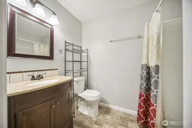 lower level full bath, access from family room & bedroom