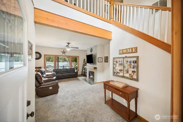 Welcoming & warm with natural wood beam & trim