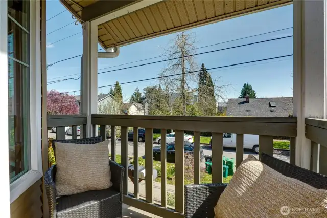 On the main floor, there's a deck overlooking the front yard and the street.