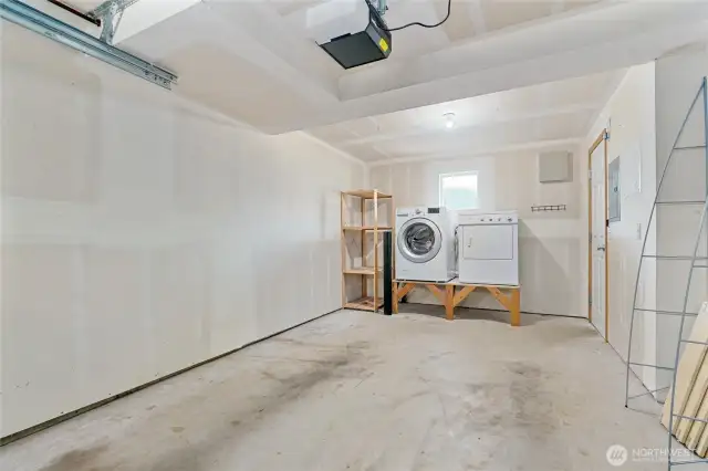 One car garage with laundry and storage area.