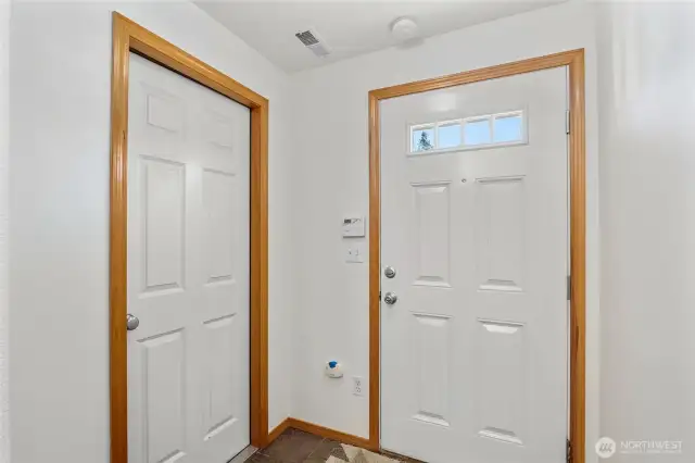 The front door is on the right and the other door leads to the garage.  The entry also has a coat closet.