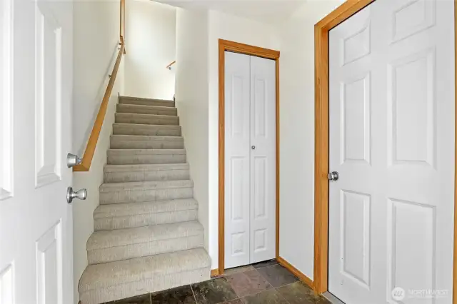 New carpet on the stairs and upper floor.  The coat closet is next to the stairs.