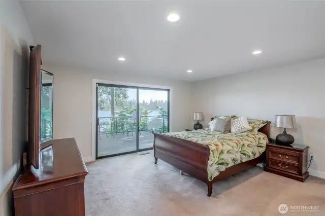 Primary bedroom with sliding glass door to rear deck