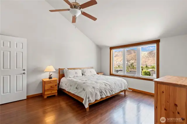 Primary suite on main floor, with en-suite bathroom and views of the river