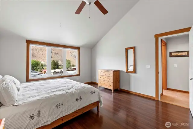 Primary suite on main floor, with en-suite bathroom and views of the river