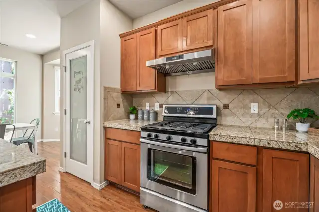 5 burner gas range and hood vent.