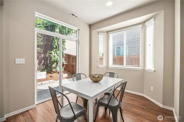 Bay window and slider to back yard.