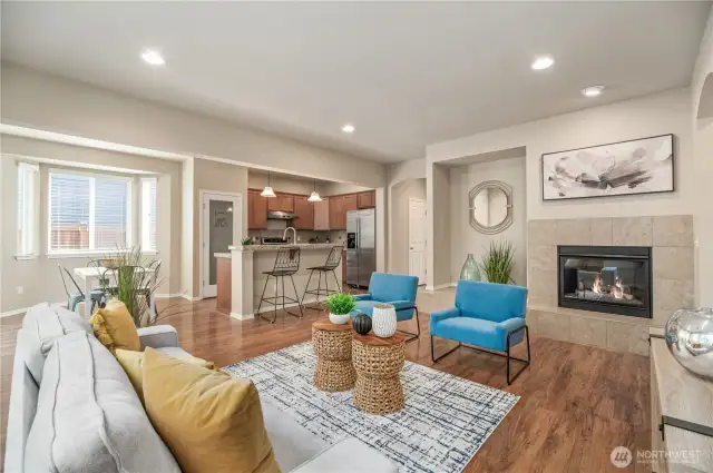 Plenty of can lighting. Wood laminate flooring throughout main level.