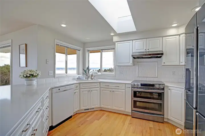 Updated kitchen with Stainless steel double oven and fridge