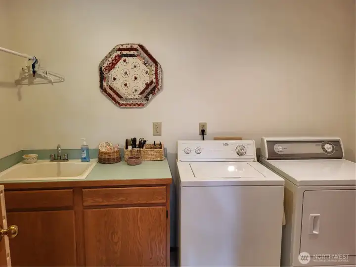 Laundry Main Floor with Over-sized Sink & Cabinets