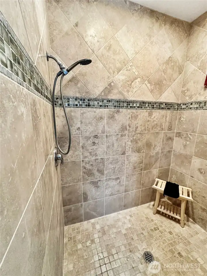 Primary bath offers this spacious, full tile walk-in shower!