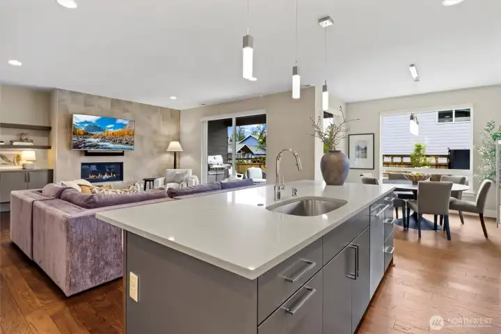 Chefs kitchen with oversized Quartz Island, Huntwood sleek cabinetry, Fisher & Paykel appliances and walk-in pantry.