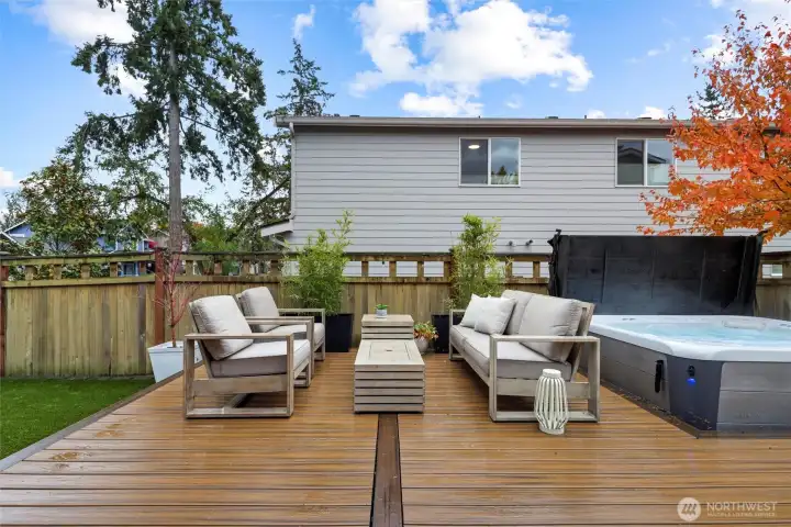 Entertainers dream backyard with Trex decking, pet friendly turf, and Hot Springs Highlife Collection Hot Tub, BBQ Gas Hookup