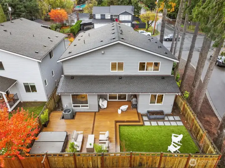 Entertainers dream backyard with Trex decking, pet friendly turf, and Hot Springs Highlife Collection Hot Tub, BBQ Gas Hookup