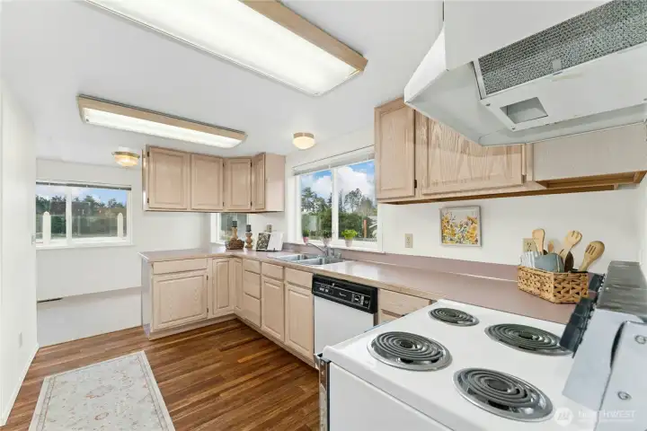 Spacious kitchen with ample storage and counter space.