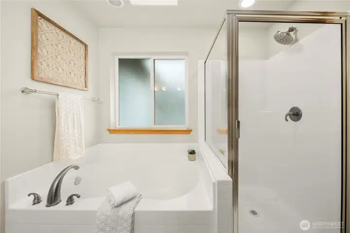 Soaking tub and separate shower.