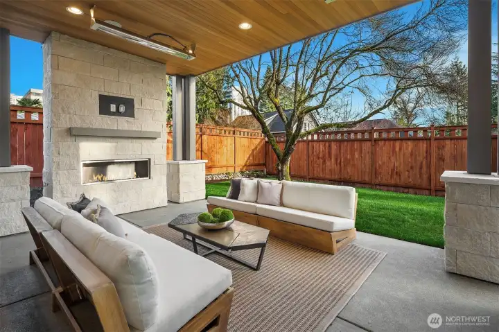 Outdoor covered living area with fireplace