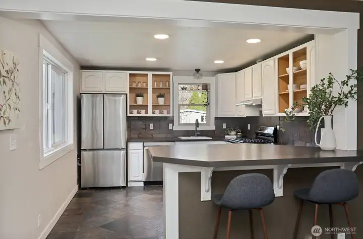 Stainless appliances and plenty of storage in the kitchen. The windows in the Main House are newer.