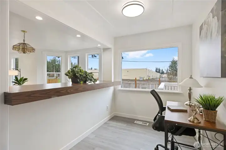 The other side of the elevated counter area provides space for an office, buttler's pantry, coffee nook, whatever best suits your needs.