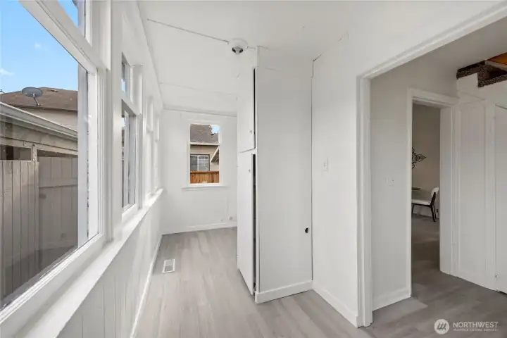 Covered back porch laundry area.