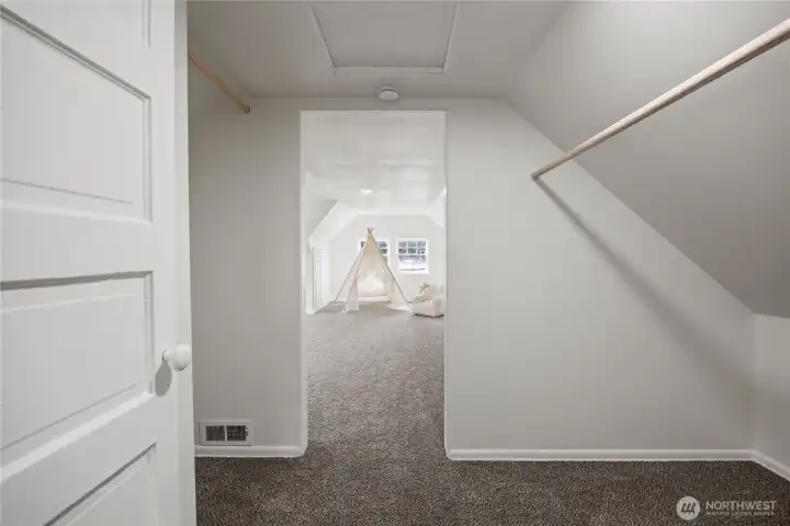 Walk through the large closet area upstairs into the massive upstairs bedroom / bonus room.