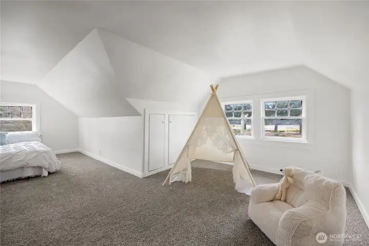 Plenty of "living space" in upstairs bedroom provides many possibilities.