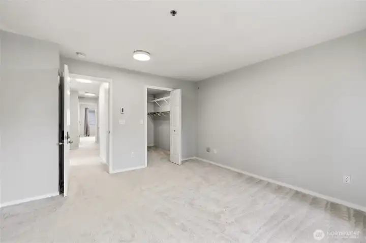 Master suite with a walk-in closet.