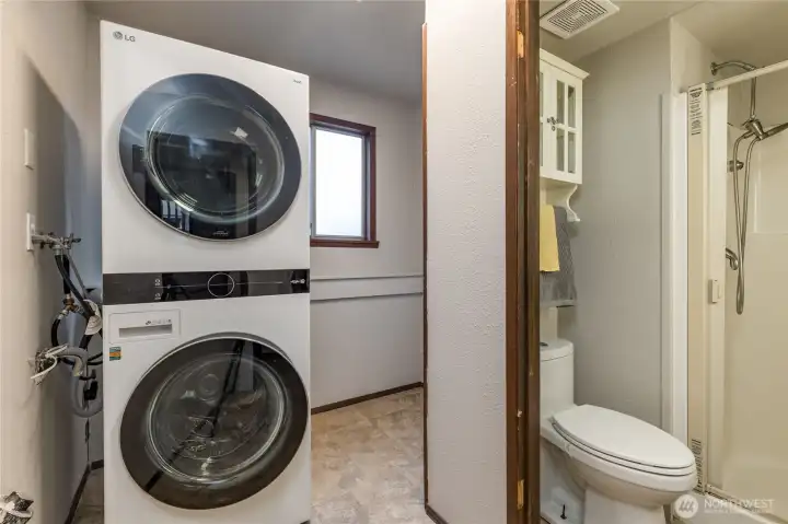 Laundry room and 3/4 bath on the lower level. Stacking washer/dryer stay!