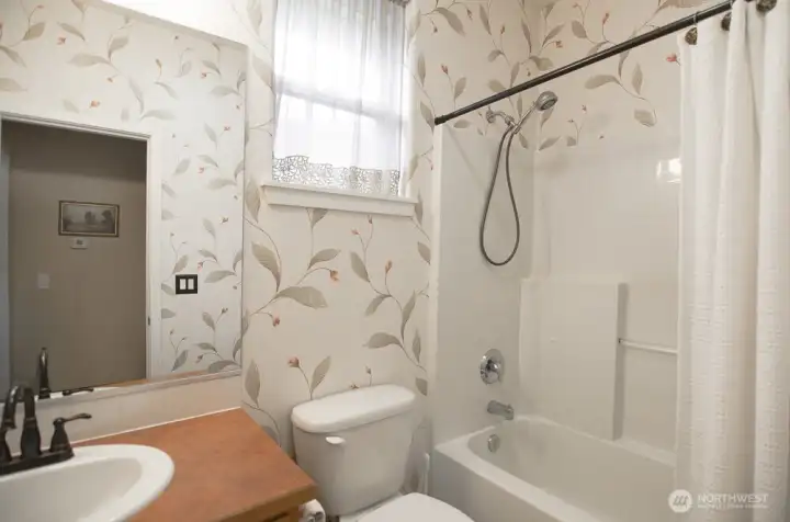 Hall full bath is conveniently centrally located.