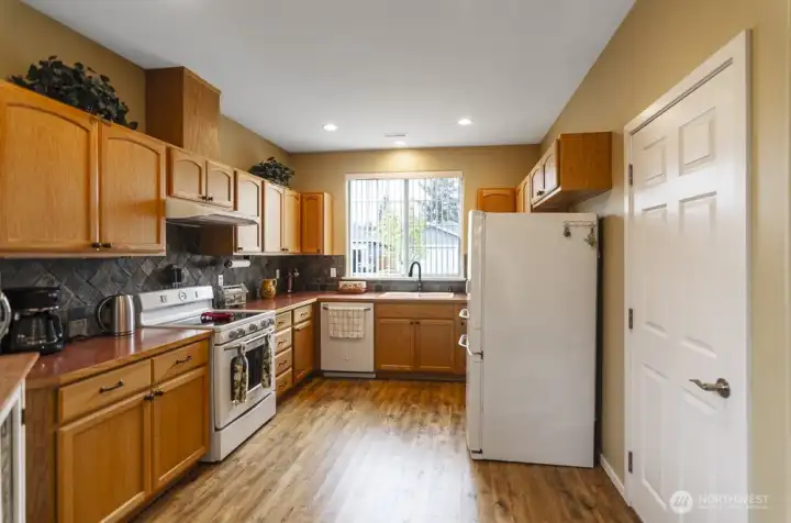 Kitchen view.  Door the the right leads to the garage, making bringing in groceries so convenient.