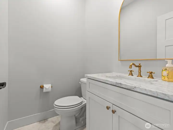 The 1/2 bath is on your way to the living space, conveniently located for guest's access. The 1/2 bath is on your way to the living space, conveniently located for guest's access.