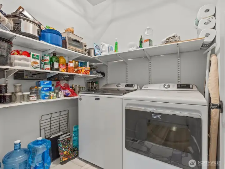 Just around the corner is the laundry room with additional storage. Just around the corner is the laundry room with additional storage.