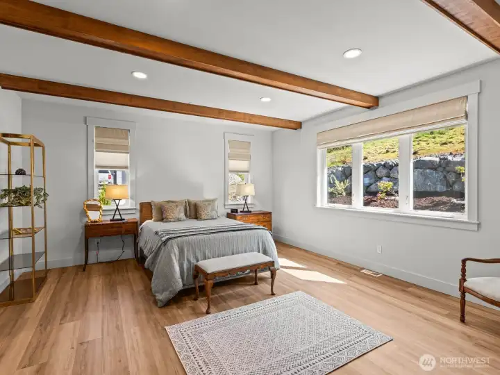 Tons of natural light and exposed beams compliment this oasis beautifully. Tons of natural light and exposed beams compliment this oasis beautifully.